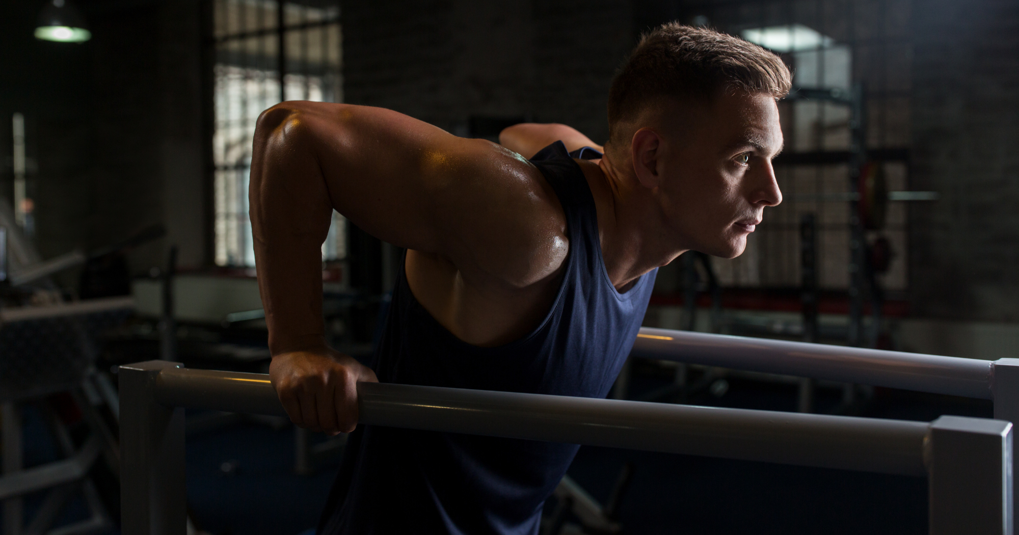 a person is doing tricep dips on a bar